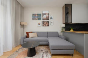 Cozy Apartment with Air Conditioner and Parking by Noclegi Renters